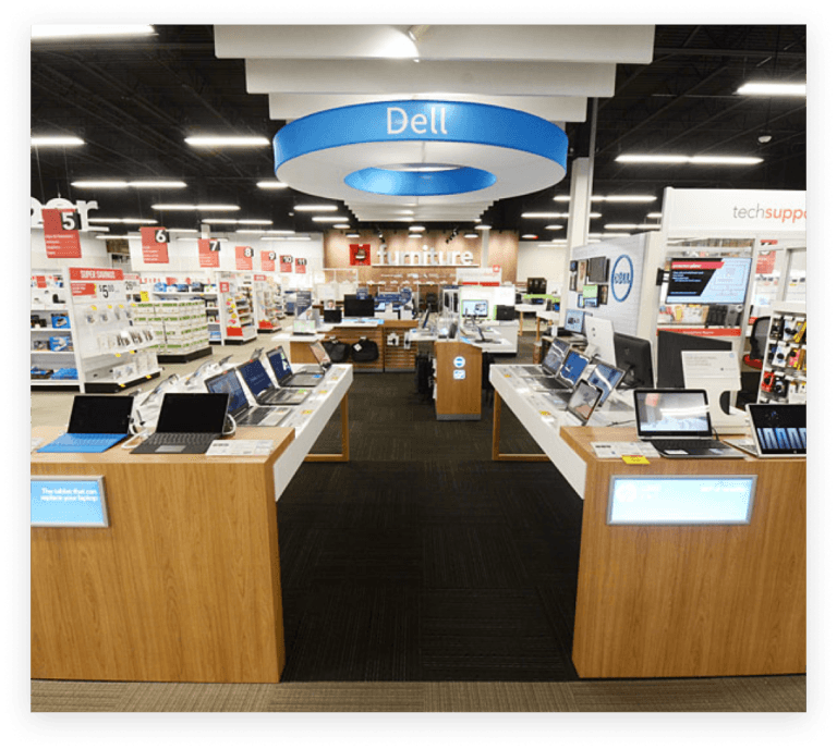 Ordinateurs Dell exposés en toute sécurité sur les tables d'Office Depot